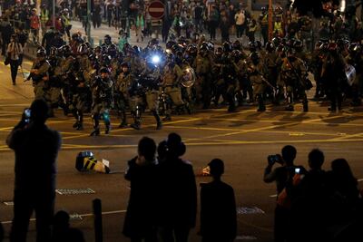 Riot police arrive to disperse anti-government protesters during a protest on Christmas Eve at Tsim Sha Tsui in Hong Kong, China. Reuters