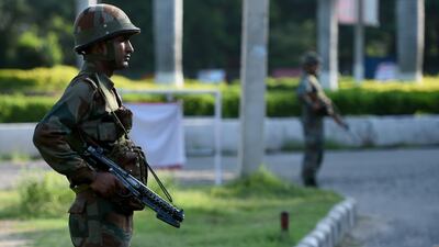 Indian soldiers stand guard in Panchkula on August 26, 2017, a day after followers of a sect ran riot in the town to protest against the conviction of their leader for rape. Money Sharma / AFP