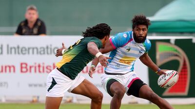 Luke Masirewa of Speranza takes on the South Africa defence during the International Invitational at The Sevens in Dubai. Chris Whiteoak / The National
