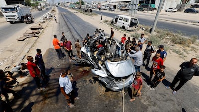 A vehicle hit by an Israeli strike in Deir Al Balah, central Gaza. Reuters