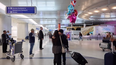 People arrive at Los Angeles International Airport on June 6. EPA
