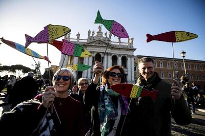 Protesters held images of sardines aloft as they took to the streets of the Italian capital. EPA