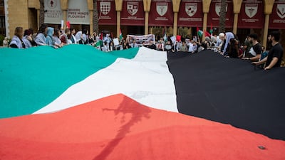 Students at the American University of Beirut unfurl a large Palestinian flag while they protest the war in Gaza on Tuesday 30th April in Beirut. All Photos: Oliver Marsden for The National