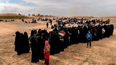 Civilians evacuated from the ISIS group's embattled holdout of Baghouz wait at a screening area held by the Syrian Democratic Forces on March 5. AFP