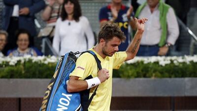Stanislas Wawrinka of Switzerland walks away after his defeat against Dominic Thiem of Austria at the Madrid Masters on Tuesday. Susana Vera / Reuters / May 6, 2014