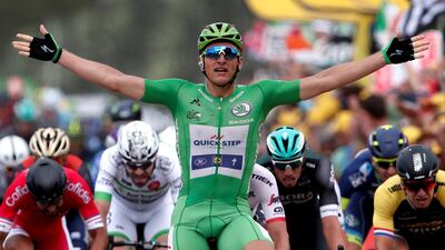 Marcel Kittel raises his arms after winning Stage 10 of the Tour de France on Tuesday. Benoit Tessier / Reuters