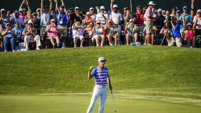 Rickie Fowler reacts after sinking a birdie putt to win the play-off at The Players Championship on Sunday. Tannen Maury / EPA / May 10, 2015