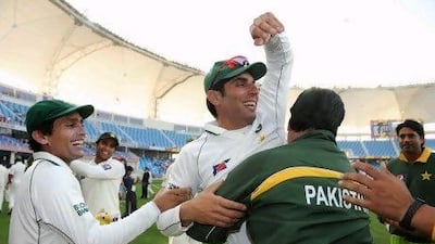 Pakistan captain Misbah-ul-Haq celebrates with coach Mohsin Khan.