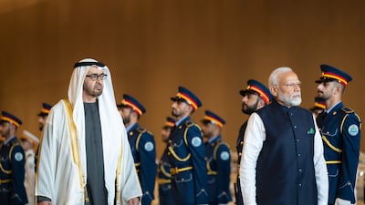 President Sheikh Mohamed and Narendra Modi, Prime Minister of India, inspect the UAE Armed Forces Honour Guard during a reception at the Presidential Airport on February 13. Abdulla Al Bedwawi / Presidential Court