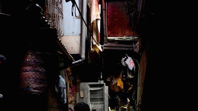 A dark alleyway in the slum areas.