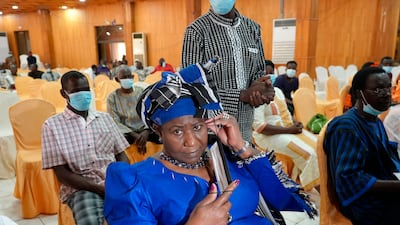 Mariam Sankara, widow of leader Thomas Sankara, sits in the courtroom where 14, including former President Blaise Compaore, stand trial for Sankara's murder, in a military court in Ougadougou, Monday, Oct. 11, 2021. A military court in Burkina Faso has started the trial of 14 people including former President Compaore for the killing of influential leftist leader Thomas Sankara, who was ousted as president by Compaore in a 1987 coup. (AP Photo / Sam Mednick)