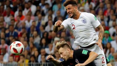 Ivan Rakitic of Croatia and Kyle Walker of England jump for the ball. EPA