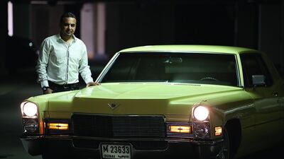 Rami ElZeini with his 1968 Cadillac Coupe de Ville in Dubai. The car, which he bought five months ago, is originally from the US. Pawan Singh / The National