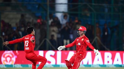 Islamabad United's Hunain Shah, right, and Ubaid Shah celebrate their team's victory after Hunain scored the winning runs against Multan Sultans off the final ball. AFP