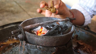 Making of the wax mould by heating it on fire to give it shape