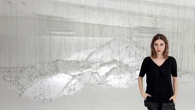 Sanaz Askari, the founder of The Mine, stands in front of an installation by Yasuaki Onishi in the gallery. Jeffrey E Biteng / The National