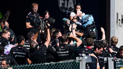Mercedes' British driver George Russell celebrates with his team after winning the Belgian Grand Prix. AFP