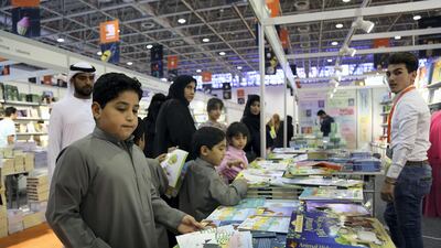 Visitors take a look at the books during the Sharjah International Book Fair at the Sharjah Expo Centre in Sharjah. Satish Kumar for the National