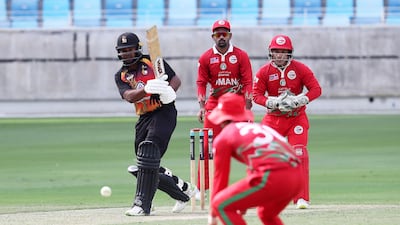 Tony Ura of Papua New Guinea plays a shot.