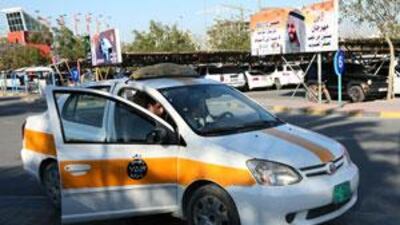A passenger pays his fare after being chauffeured by an independent driver to Manai Mall in Ras al Khaimah.