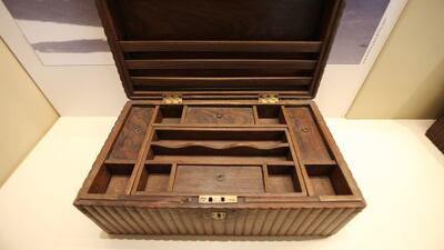 A wooden box used by pearl merchants on display at the museum.