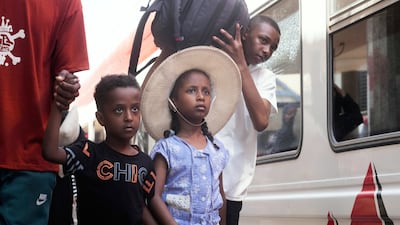 Sudanese families board a train in Cairo to return home to their war-torn homeland. AP