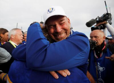 Team Europe's Francesco Molinari celebrates with captain Thomas Bjorn after winning the Ryder Cup in 2018. Reuters