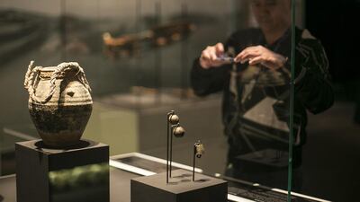A glazed jar and bells at the launch of the Qasr Al Hosn 2018 master plan for the development of the fort. Mona Al Marzooqi / The National