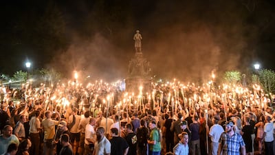 White nationalists participate in a torch-lit march in Charlottesville, Virginia, in August 2017. Reuters