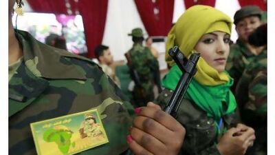 Female volunteer government fighters attend a women's forum in Tripoli yesterday. Louafi Larbi (/ Reuters