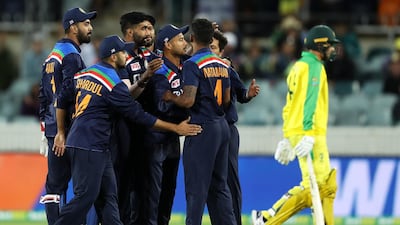 T Natarajan of India celebrates with his team after taking the wicket of Ashton Agar in the third ODI against Australia. Getty