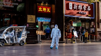 Police in protective gear patrol the Nanjing street shopping area, in Shanghai, China. EPA