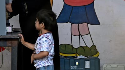 An Indian voter casts her vote at a polling station in Bulandshahr, in Uttar Pradesh. AFP