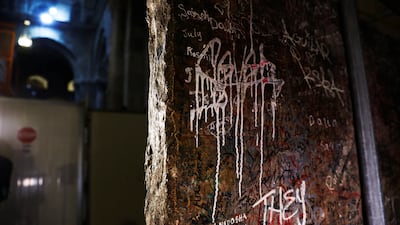 Grafitti covers the slab believed to be the rediscovered altar frontal.