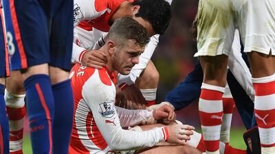 Arsenal’s Jack Wilshere sits up after being injured during the English Premier League match between Arsenal and Manchester United at the Emirates Stadium, London, Saturday, November 22, 2014. Tim Ireland / AP Photo