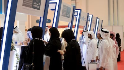 Visitors are briefed for jobs at an Emiratisation recruitment fair at Adnec. Ravindranath K / The National
