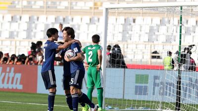 Yuya Osako is congratulated on scoring.