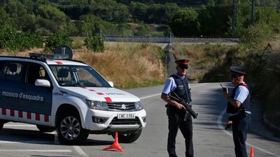 Armed police officers stand guard near Subirats, Spain, on Monday, August 21, 2017. Emilio Morenatti / AP