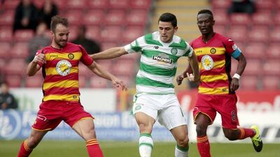 Patrick Thistle's Sean Welsh, left, and Abdul Osman, right, in action against Celtic's Tom Rogic on Sunday. Reuters / Graham Stuart