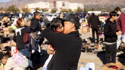 People who fled the Eaton Fire gather at a donation centre in Santa Anita Park, California. AFP