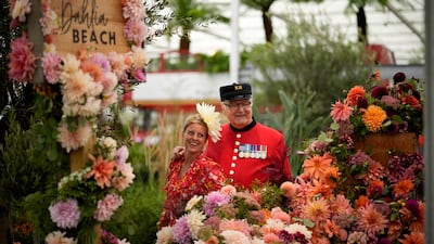 Also on Monday, the Chelsea Flower Show, hit by pandemic closures that forced events to go online last year, opened its first autumnal show. AP Photo