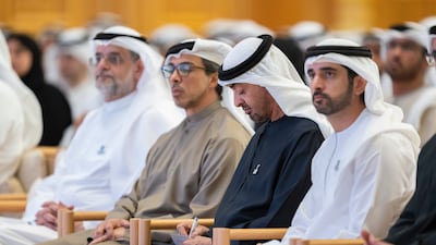 Sheikh Mohamed takes notes during the national session held fourth anniversary of the Day of Solidarity at Qasr Al Watan
