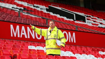 A steward evacuates fans from the ground prior to the Premier League match between Manchester United and AFC Bournemouth at Old Trafford on May 15, 2016 in Manchester, England. (Alex Livesey/Getty Images)