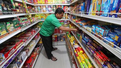 Abu Dhabi, United Arab Emirates - December 27th, 2017: Workers at local shop Baqala to go with a story on VAT. Wednesday, December 27th, 2017 in Abu Dhabi. Chris Whiteoak / The National
