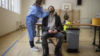 A man is tested during Covid-19 mass testing in Zuoz, Switzerland. EPA