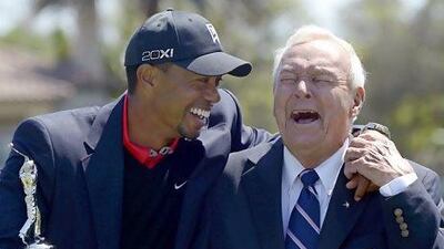 Tiger Woods, left, and Arnold Palmer share a laugh during the trophy presentation after Woods won the Arnold Palmer Invitational golf tournament in Orlando, Fla., Monday, March 25, 2013. (AP Photo/Phelan M. Ebenhack) *** Local Caption *** APTOPIX Bay Hill Golf.JPEG-09bc7.jpg