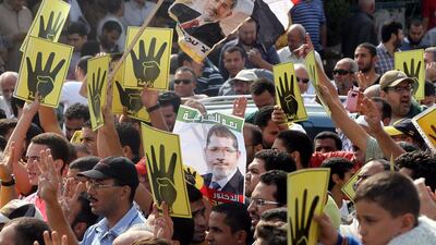Supporters of former Egyptian president Mohammed Morsi hold a protest in Cairo on Friday. Khaled Elfiqi/EPA