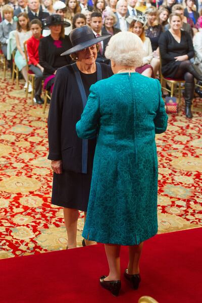 Dame Maggie Smith being made a member of the Order of the Companions of Honour by Queen Elizabeth II during an investiture ceremony at Windsor Castle in 2014. PA