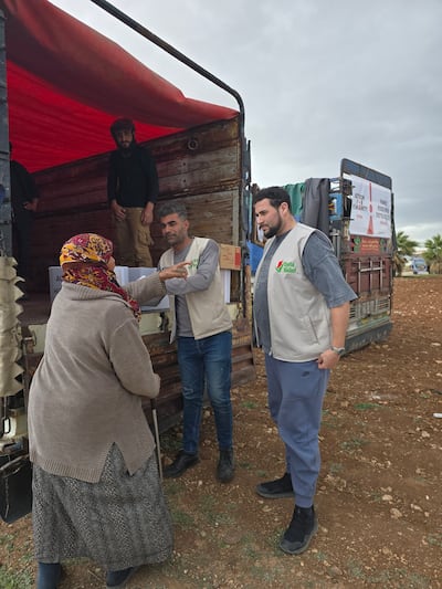 Adam Kelwick and colleagues providing aid in the town of Kafr Zaita, in western Syria. Photo: Adam Kelwick