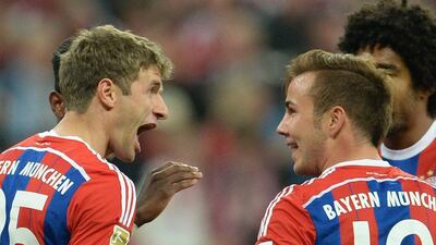 Bayern Munich's Mario Gotze, right, celebrates with Thomas Muller, left, after scoring the opening goal in Bayern's 4-0 win over Paderborn on Tuesday in the Bundesliga. Andreas Gebert / EPA / September 23, 2014